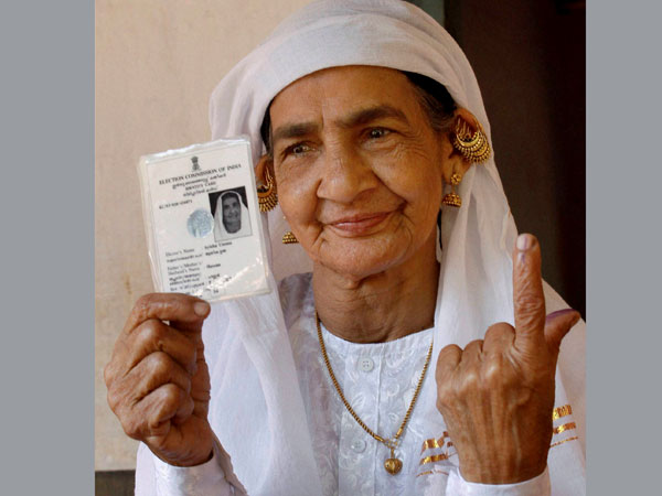 A woman shows her finger after casting the vote A woman shows her finger after casting the vote