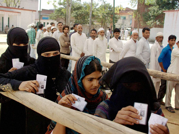 Muslim voters wait to cast their votes Muslim voters wait to cast their votes