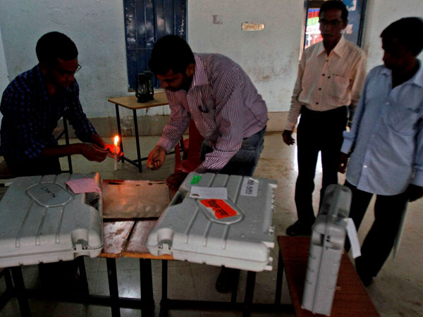 Election officers seal polling material at the end of voting 