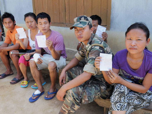 Voters wait to cast their votes for Lok Sabha polls Voters wait to cast their votes for Lok Sabha polls