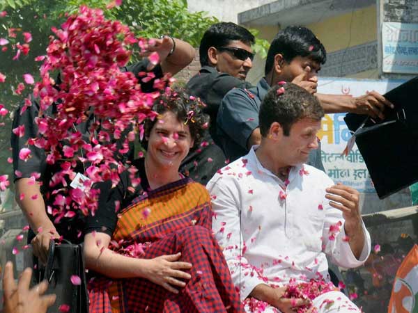 Supporters shower flower petals on Congress Vice President Rahul Gandhi Supporters shower flower petals on Congress Vice President Rahul Gandhi