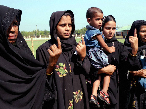 Women voters show their ink marked fingers Women voters show their ink marked fingers