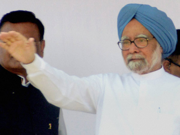 Manmohan Singh waves during an election rally at Puranpur Manmohan Singh waves during an election rally at Puranpur
