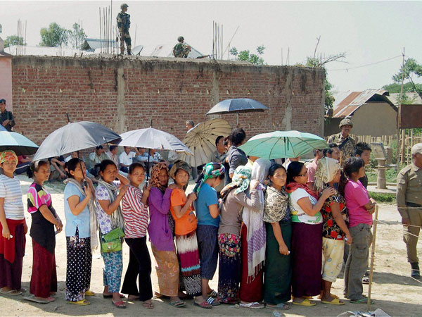 People wait to cast votes during re-polling for Lok Sabha People wait to cast votes during re-polling for Lok Sabha