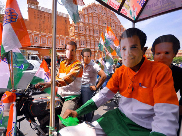 Congress workers wearing masks of party's President Sonia Gandhi and Vice President Rahul Gandhi Congress workers wearing masks of party's President Sonia Gandhi and Vice President Rahul Gandhi