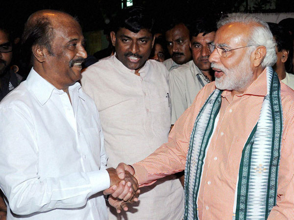 Narendra Modi shakes hands with superstar Rajinikanth