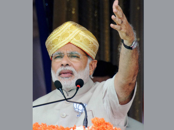Narendra Modi addresses at a public rally to campaign