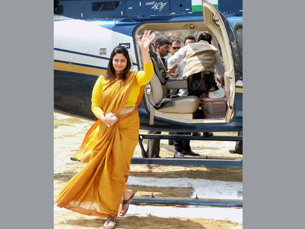 Nagma waves to her supporters during an election campaign