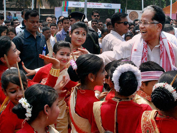 Tarun Gogoi with children during the festival of Rongali Bihu 