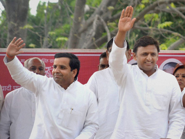 Akhilesh Yadav waves to crowd during an election rally