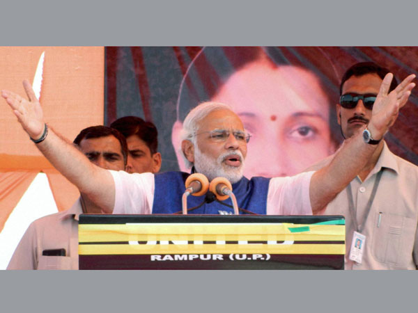 Narendra Modi addresses an election campaign rally in Pilibhit