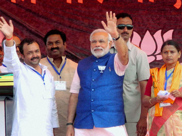 Narendra Modi addresses an election campaign rally in Pilibhit