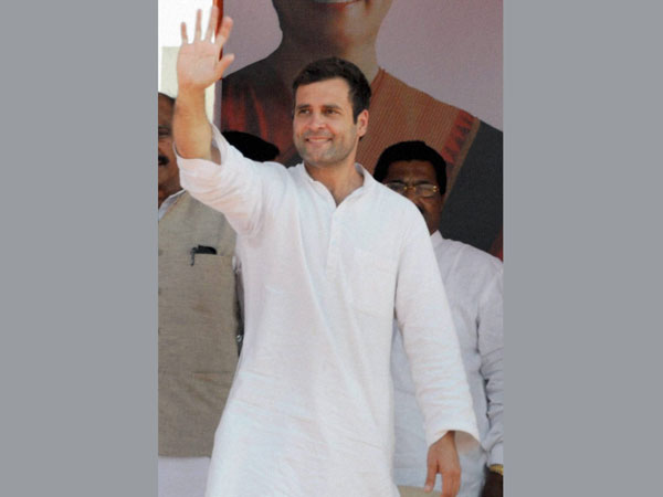 Rahul Gandhi waves to the supporters during an election rally