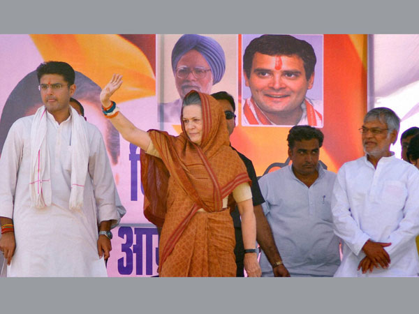 Sonia Gandhi waves to the supporters during an election rally