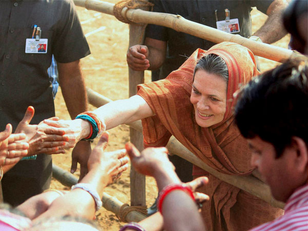 Sonia Gandhi interacts with party workers during an election
