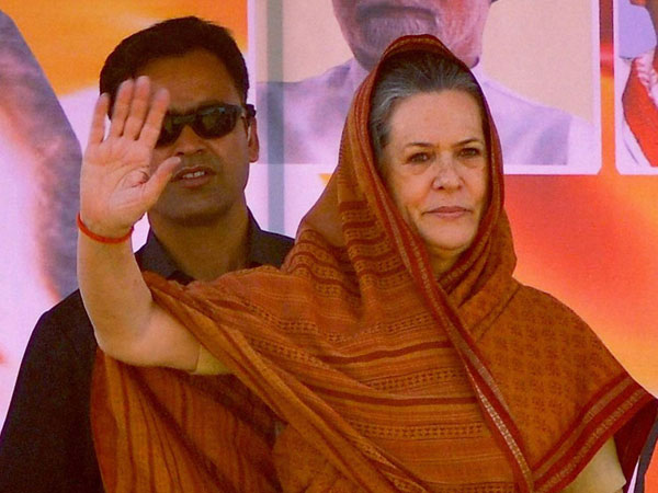 onia Gandhi waves to the supporters during an election rally