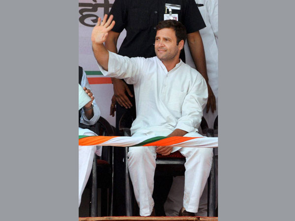 Rahul Gandhi waves at an election campaign rally in Pune