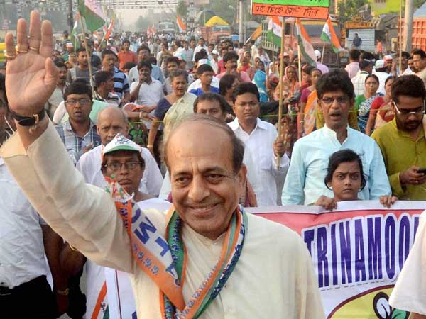 Dinesh Trivedi waves during his election campaign