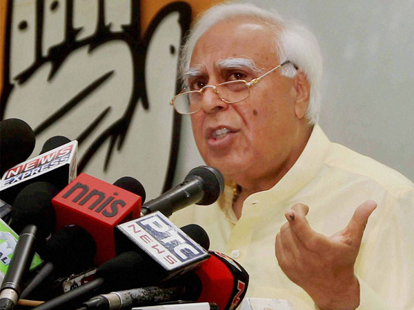 Kapil Sibal addresses a press conference