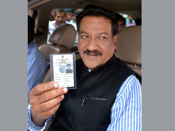 Prithviraj Chavan shows his voter identity card