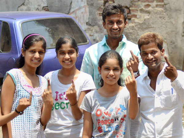 First-time voters show their inked fingers 