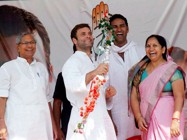 Rahul Gandhi is presented a bow and arrow a memento 