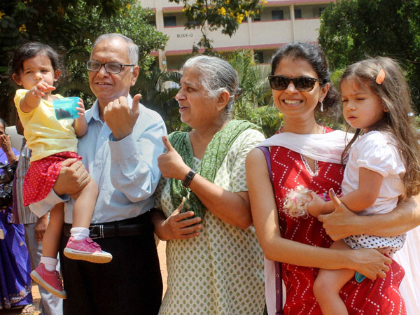 N R Narayana Murthy with his family after casting votes