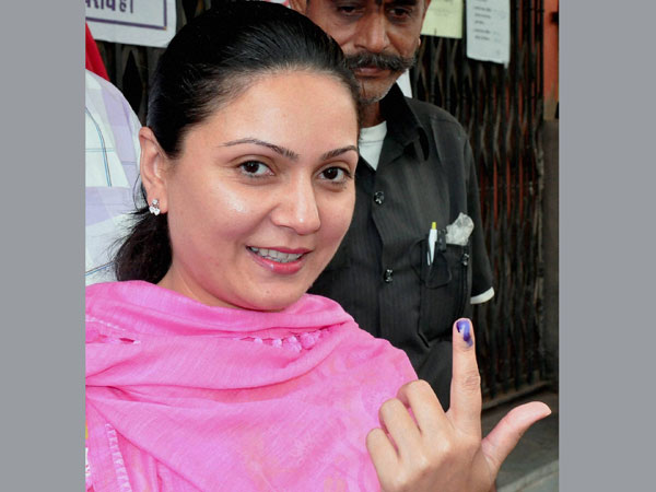 BJP MLA Princess Siddhi Kumari shows her ink-marked finger