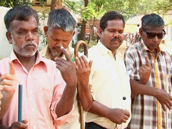 Blind Voters showing their ink-marked finger