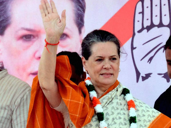Sonia Gandhi waves at an election meeting in Neemuch