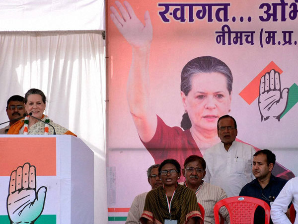 Sonia Gandhi waves at an election meeting
