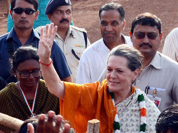 Sonia Gandhi waves at an election meeting in Neemuch