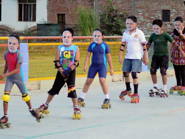 Skating students wear mask