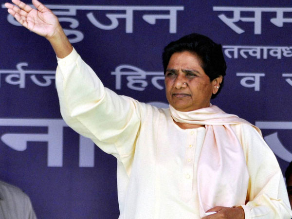 Mayawati waves to her supporters during an election rally