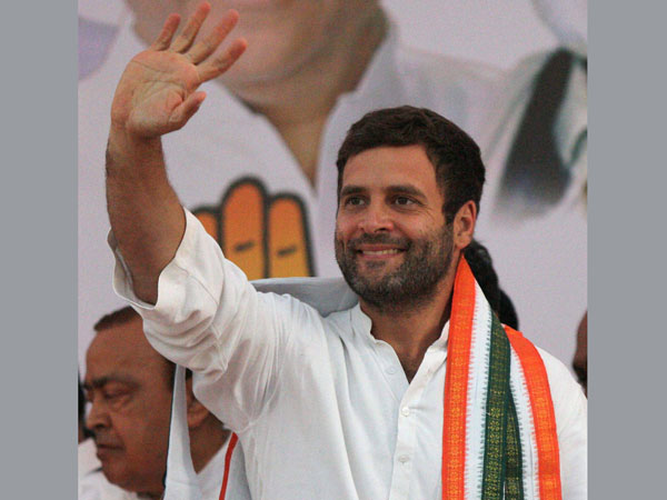Rahul Gandhi waves during an election rally in Mumbai