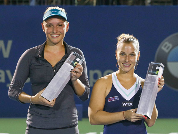 Winners smile with their trophies