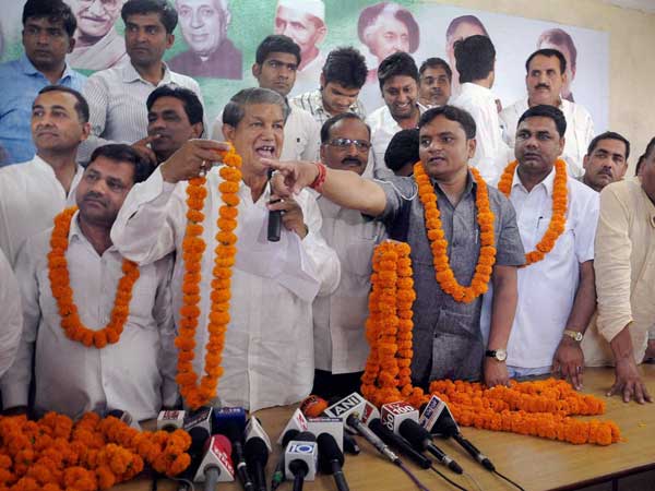 Harish Rawat welcomes BSP ML Surendra Rakesh's brother