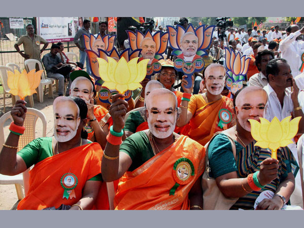 BJP supporters wear mask of Narendra Modi 