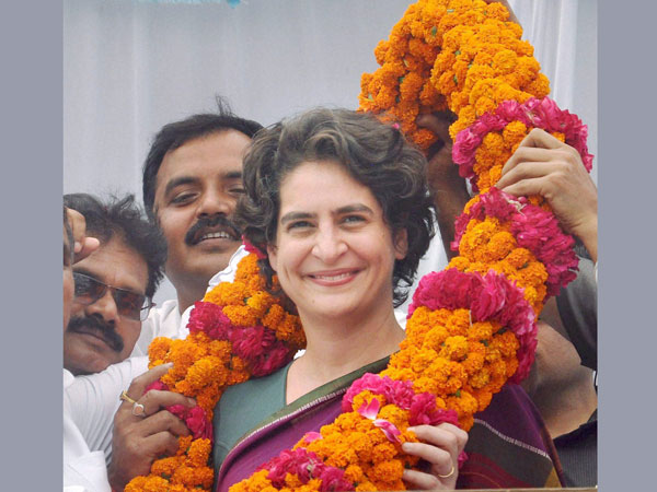 Priyanka Vadra is garlanded during an election campaign