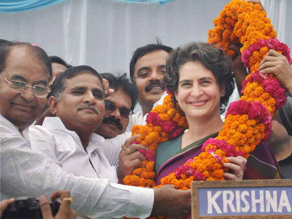 Priyanka Vadra is garlanded during an election campaign