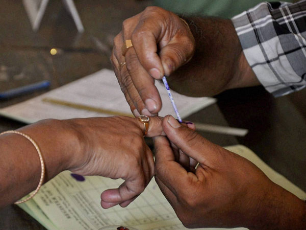 Polling office applies ink mark on the finger