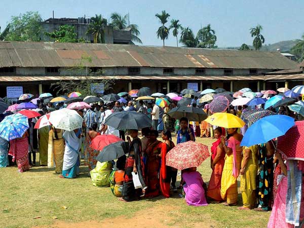 People standing in queue to cast their vote