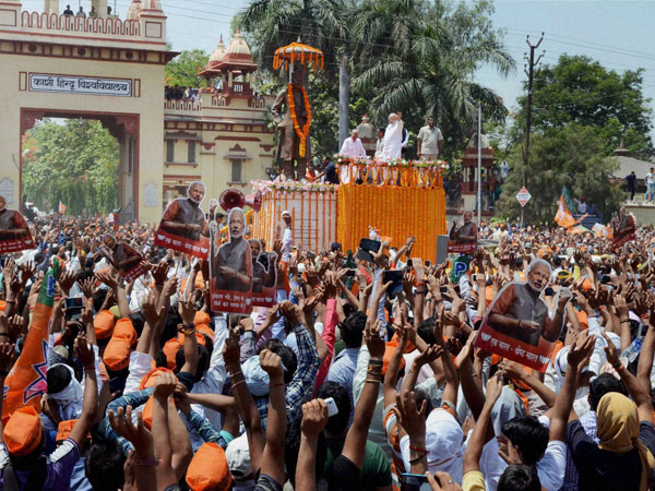 Narendra Modi waves at supporters