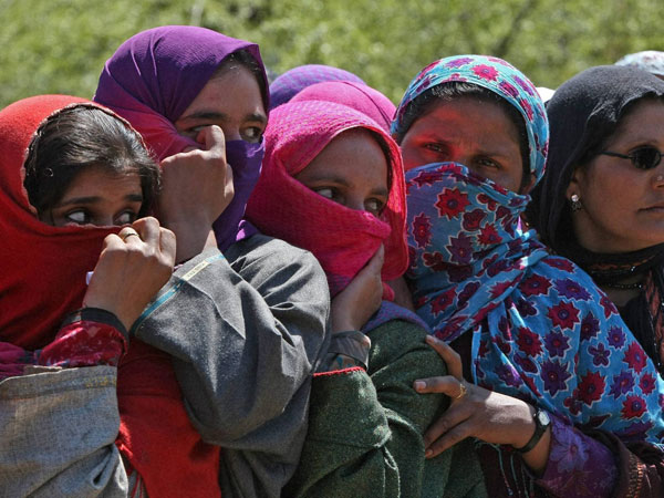 Women voters waiting for their turn to cast their votes