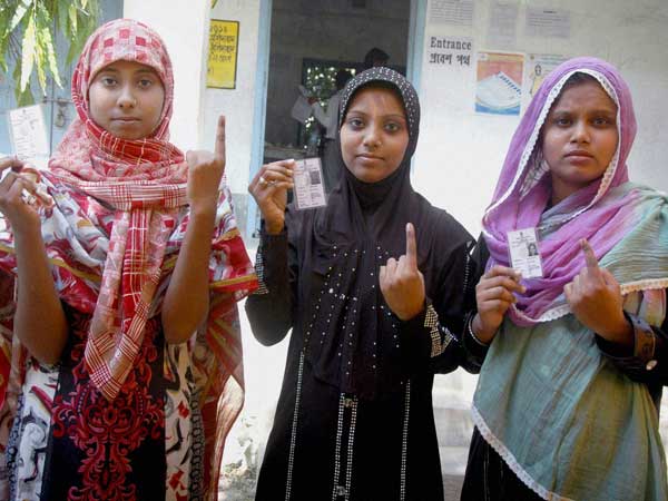 Muslim women show their inked fingers