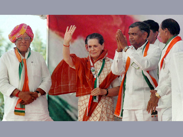 Sonia Gandhi waves during an election rally