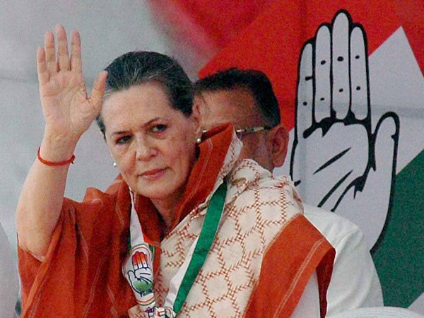 Sonia Gandhi waves during an election rally