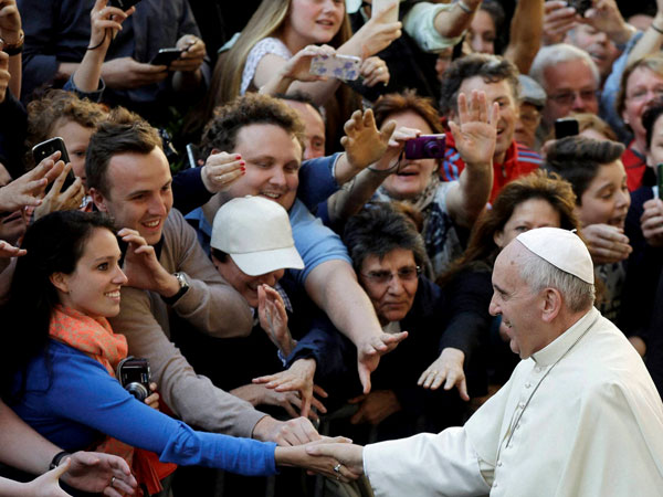 Pope Francis greets visitors 