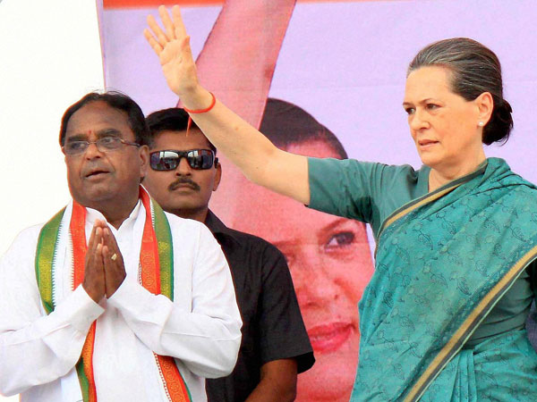Sonia Gandhi waves at an election meeting at Chevella