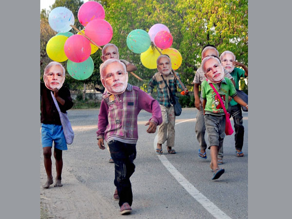 Narendra Modi's masks along a road in Patiala